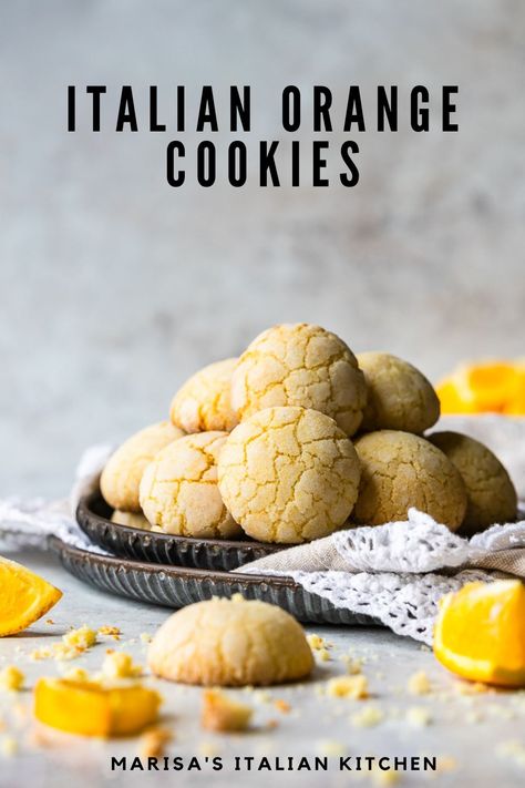 Tender and crumbly Italian Orange Cookies made with orange zest and juice on a serving tray. Orange Amaretti Cookies, Orange Cookies Dipped In Chocolate, Easy Orange Cookies Recipes, Orange Ball Cookies, Orange Short Bread Cookie, Orange Zest Sugar Cookies, Easy Orange Cookies, Citrus Cookie Recipes, Chocolate And Orange Cookies