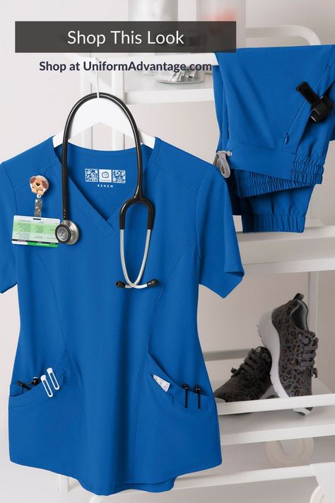 Blue scrub top with pockets hanging on rack next to blue scrub pants Medical Scrubs Fashion, Beauty Uniforms, Wonderwink Scrubs, Stylish Scrubs, Medical Scrubs Outfit, Nurse Aesthetic, Saving The Planet, Scrubs Outfit, Uniform Advantage