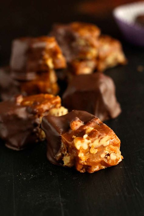 Pieces of chocolate covered California brittle on dark background. See's Peanut Brittle Recipe, Sees Candy, Penuche Fudge, Peanut Brittle Recipe, Crunch Recipe, Sees Candies, Brittle Recipes, Toffee Recipe, Bake Sale Recipes