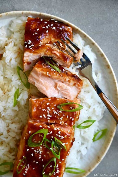 This Baked Salmon with Honey-Garlic Glaze has turned many a salmon-hater into a salmon-lover! It has the perfect balance of sweet and savory flavors thanks to an abundance of fresh garlic, ginger, honey, soy sauce and my not-so-secret ingredient, pineapple juice. Serve with your fave side and dinner is done! Honey Garlic Glazed Salmon, Simple Baked Salmon, Honey Baked Salmon, Barramundi Recipes, Honey Soy Salmon, Asian Salmon Recipes, Pineapple Salmon, Oven Salmon, Honey Glazed Salmon