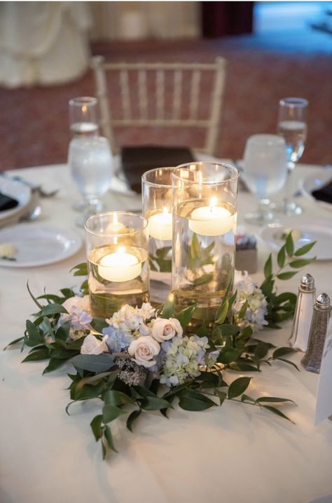 Floating candle wedding centerpiece with greenery and flowers by Eden Events Centerpiece With Greenery, Floral Centerpieces Wedding, Wedding Centerpeices, Round Wedding Tables, Floating Candles Wedding, Candle Table Centerpieces, Winter Wedding Centerpieces, Floating Candle Centerpieces, Wedding Renewal