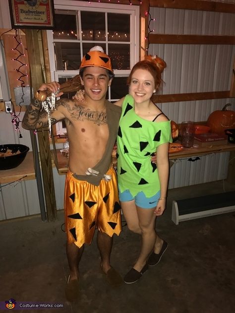 Megan: This is the couple of the year- Meg and Antonio. Known for their cuteness, they decided to be the cutest couple in TV History-Pebbles and Bam Bam. To create this... Pebbles And Bam Bam Costumes, Bam Bam Costume, Couple's Costume, Flintstones Costume, Pebbles Costume, Pebbles And Bam Bam, Couples Kiss, Dino Costume, Funny Couple Halloween Costumes