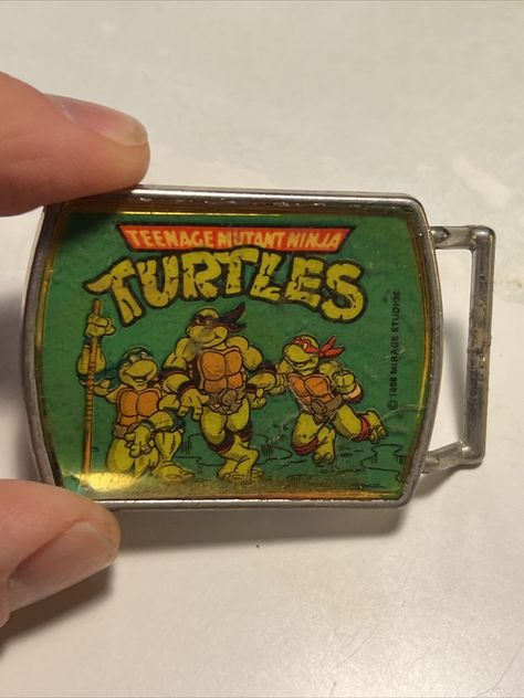 You are bidding on a 1988 Lee Brand Teenage Mutant Ninja Turtle Belt Buckle 2" x 1.5".  It has some wear from age and use.  See pictures for best details    The item you are buying is the picture listed unless stated otherwise.  Please contact me if you have questions.  I want to keep my great positive rating.  I will gladly work with you if there is a problem. I will always combine shipping for more than one purchase, so wait for an invoice for more than 1 purchase.  Please check out my other i Tmnt Merch, Tmnt Comics, Teenage Ninja Turtles, Teenage Ninja, Tmnt Turtles, Teenage Mutant Ninja Turtle, Ninja Turtle, Poses References, Comic Collection