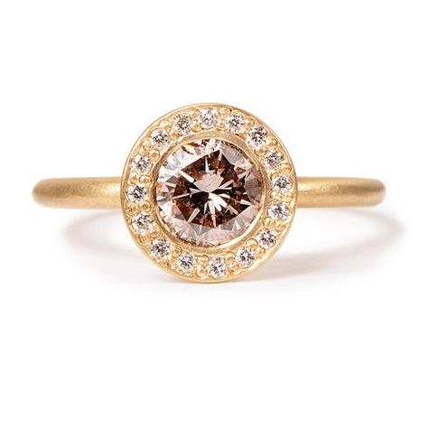 This exquisite ring features a warm cognac diamond with a halo of brilliant diamonds. It is perfect as an alternative engagement ring. Center diamond: 0.85 total weight Pave diamonds: 0.12 total weight Metals: 14k yellow gold Currently available in a size 6.5. See customer care for sizing information. Handmade in USA Item number: 135-00016 Reasonable Engagement Rings, Radient Engagement Rings, Engagement Ring Selfie, Gold Wedding Bands Women, Rebecca Overmann, Eternity Engagement Ring, Gold Anniversary Rings, Gold Sapphire Ring, Floral Engagement Ring