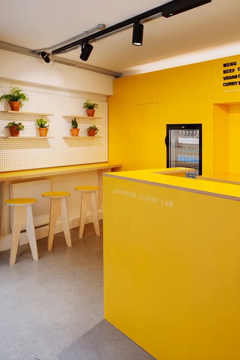 Food Hub Design, Unli Wings, Yellow Coffee Shop, Small Restaurant Interior, Yellow Restaurant, Interior Design Yellow, Kitchen Staging, White Restaurant, Pop Of Yellow