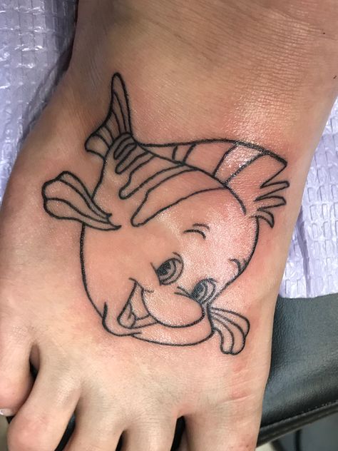 Little mermaid flounder tattoo Flounder Tattoo, The Little Mermaid Tattoo Ideas, Ariel Tattoo Ideas, Ariel And Flounder Tattoo, Simple Ariel Tattoo, Ariel Inspired Tattoo, Hades Tattoo, Little Mermaid Tattoo, Baby Memorial Tattoos