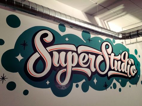 I recently went to a viewing of "Sign Painters: The Movie" and got a wild hair up my ass to do a mural. I designed and hand painted this mural over the course of 3 days, and it ended up being just ... Spray Paint Mural, Mural Typography, Studio Mural, Super Studio, Brush Typography, Office Wall Graphics, Mural Cafe, Sign Painting Lettering, Trick Art