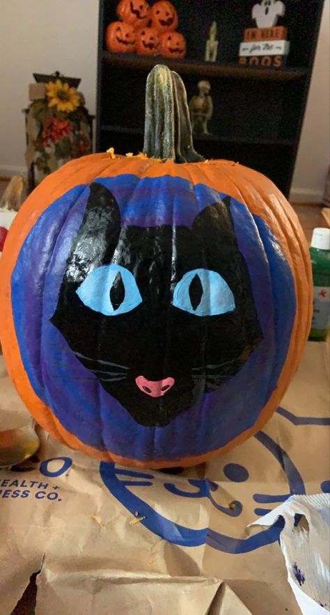 Blue and purple swirl background with black cat from coraline with blue eyes and a pink nose Pumpkin Painting Coraline, Pumpkin Painting Ideas Coraline, Easy Coraline Painting, Black Cat On Pumpkin Painting, Pumkin Paintings Idea Cute Coraline, Coraline Pumpkin Painting, Coraline Painting, Cat From Coraline, Coraline Cat