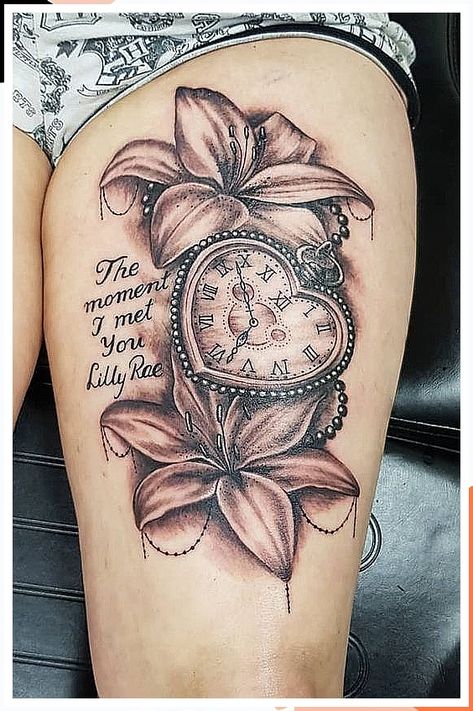 A clock tattoo symbolizes the passage of time and the importance of making the most of each moment. Thigh Memorial Tattoos, Tattoos With Clocks For Women, Clock Tattoos For Women Kids, Tattoos For Moms With Kids Sleeve, Watch Tattoos For Women, Tattoos For Moms With Kids Sons, Clock Tattoo Ideas For Women, Tattoo Ideas For Moms With Sons, Tattoo Ideas On Thigh