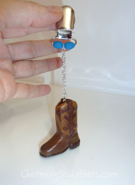 Cowboy boot polymer clay tablecloth weight charm. For more information visit www.CharmingSculptHers.com Polymer Clay Cowboy Boots, Clay Cowboy Boot, Western Crafts, Lighter Case, Country Diy, Cute Paintings, Craft Day, Clay Art Projects, Diy Clay Crafts