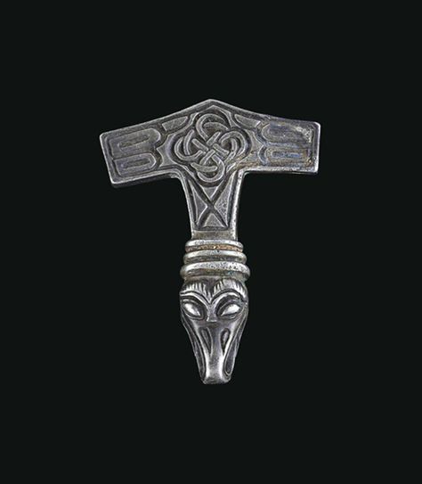 A VIKING SILVER PENDANT  CIRCA 10TH-EARLY 11TH CENTURY A.D.  Cast in the form of Thor's hammer, boat-shaped and pointed at the base, the surface embellished with an interlace design and other filling motifs, the shaft with a ribbed collar and an avian head terminal, its open beak serving as the suspension loop Princess Cut Diamond Earrings, Viking Jewellery, Fake Diamond, Thor's Hammer, Jewelry Design Inspiration, Viking Art, Jewelry Tags, 11th Century, Viking Age