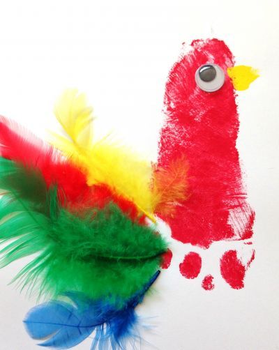 Colourful parrot footprint keepsake craft for baby or toddler. Parrot Footprint, Jungle Camp, Pirate Week, Parrot Craft, Painting Crafts For Kids, Jungle Crafts, Zoo Crafts, Pirate Crafts, Keepsake Crafts