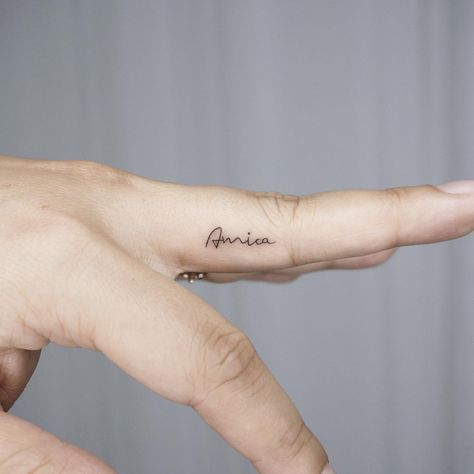 Tiny name finger tattoo Minimal Name Tattoo Ideas, Name Tattoo Ring Finger, Name Tattoos On Fingers For Women, Letter A Finger Tattoo, Let Them Finger Tattoo, Tiny Letter Tattoo Finger, Name Tattoos On Finger, Finger Name Tattoos For Women, Name On Finger Tattoo