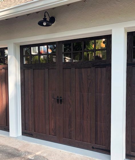 Achieve the sophisticated look of a wood carriage house garage door—without the added maintenance. Shown: Model 5602 in Walnut Accents Woodtones with Stockton windows and Wrought Iron hardware. Chi Garage Doors, Custom Wood Garage Doors, Carriage Style Garage Doors, Carriage House Garage Doors, Single Garage Door, Carriage House Doors, Garage Door Windows, Garage Door Panels, Wooden Garage Doors