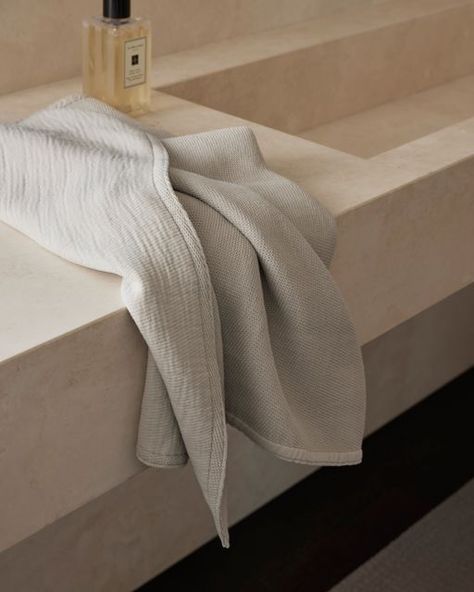 Society Limonta on Instagram: "The precious textures of KUR and CRISP towels mixed with an intriguing play of light shape the most comfortable experience of wellness. 

Project: Fluid Home
Architecture: @alessandro_isola

#societylimonta #fluidhome #bathroomtowels #bathroom #towelset #towel #bathroomtowel #bathroomdecor" Bedding Accents, Sheet Society, Society Limonta, Modern Bath Towels, Italian Textiles, Ceramic Furniture, Embossed Pattern, Luxurious Bed, Console Cabinet