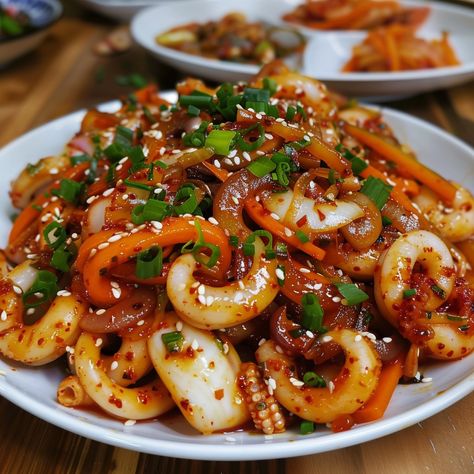 🐙 Savor the spicy and flavorful Ojingeo Bokkeum! 🌶️✨ #OjingeoBokkeum #KoreanCuisine Ojingeo Bokkeum (Spicy Stir-Fried Squid) Ingredients: Squid, cleaned and sliced (1 lb) Gochujang (Korean chili paste) (2 tbsp) Soy sauce (1 tbsp) Garlic, minced (3 cloves) Onion, sliced (1) Carrot, julienned (1) Bell pepper, sliced (1) Green onions, chopped (1/2 cup) Sesame oil (1 tbsp) Sesame seeds (1 tbsp) Vegetable oil (for cooking) Instructions: Marinate squid in gochujang, soy sauce, and garlic for 20... Ojingeo Bokkeum, Fried Squid, Korean Chili, Korean Chili Paste, Instagram Recipes, Twisted Recipes, Chili Paste, Trending Recipes, Cooking Instructions