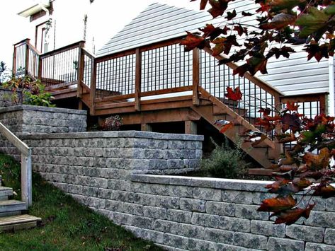 Stone Patio & Retaining Wall | Archadeck of Nova Scotia Patio Retaining Wall, Aluminum Railings, Pressure Treated Deck, Stone Patios, Stone Retaining Wall, Deck Installation, Stone Patio, Sunroom Designs, Deck Stairs