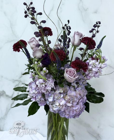 🌿💜 This stunning centerpiece, crafted with dark purple and lavender-toned flowers, exudes a luxurious and elegant vibe, perfect for any occasion. "Where flowers bloom, so does hope." – Lady Bird Johnson Visit us in Round Rock, Texas, and bring a touch of elegance to your event with our exclusive arrangements. 📍 Visit Us: 110 E. Anderson Ave. #300, Round Rock, TX 🕒 Store Hours: Monday - Friday : 8:30 - 5:30 and Saturdays 8:30 - 1:00 ☎️ Call at: (512)244-2711 ****Disclaimer: every product ... Lavender And Red, Purple Flower Arrangements, Round Rock Texas, Debut Ideas, Dark Purple Flowers, Lady Bird Johnson, Round Rock, Flowers Bloom, Lady Bird