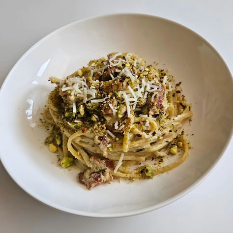 Bacon and Pistachio Carbonara A pasta dish featuring crispy bacon, a creamy sauce made with egg yolk, parmesan cheese and ground pistachios, and a touch of spice, all tossed with linguine noodles #carbonara #baconcarbonara #pistachiocarbonara #pasta #fridaydinner #homecookedrecipes #pastarecipes Bacon Carbonara, Friday Dinner, Touch Of Spice, Homecooked Meals, Pasta Dish, Linguine, Crispy Bacon, Creamy Sauce, Parmesan Cheese