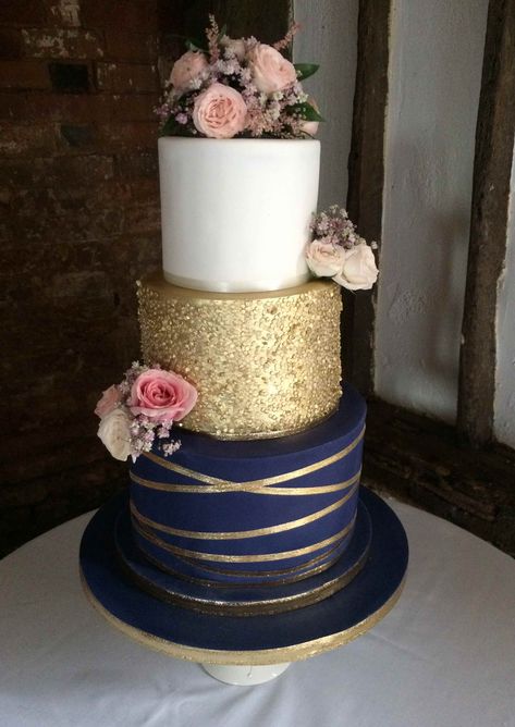 Lisa, 3 tier navy blue and gold theme wedding cake with gold sequin tier and fresh flower decorations 3 Tier Wedding Cake Navy Blue, Navy And Blush Cake, Gold And Navy Wedding Cake, Navy Blue Gold Wedding Cake, Wedding Cakes Blue And Gold, Navy Gold Party Decorations, Navy Blue Gold Cake, Gold And Blue Wedding Cake, Wedding Cake Navy Blue And Gold