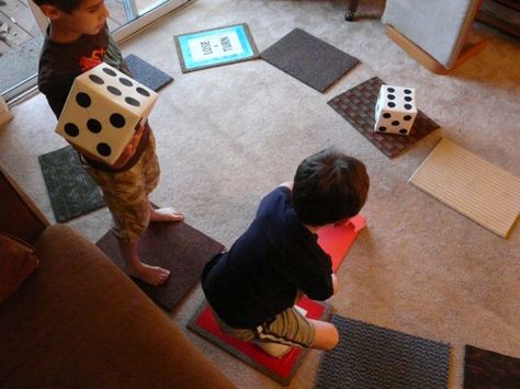 If you’re playing with children 6 and younger, you may want to keep things simple, and make the object of the game reaching the “Finish” space first. This variation is a good exercise in counting. You can add interest by making spaces and cards that interrupt that flow, sending players a few spaces ahead or back, or causing them to lose a turn. If you’re playing with children 7 and up, then you can add more challenge. You might, for example, try creating some branches in the game path that l... Life Size Games, Family Math Night, Life Board Game, Math Night, Board Games Diy, Life Board, Program Ideas, Diy Games, Preschool Fun