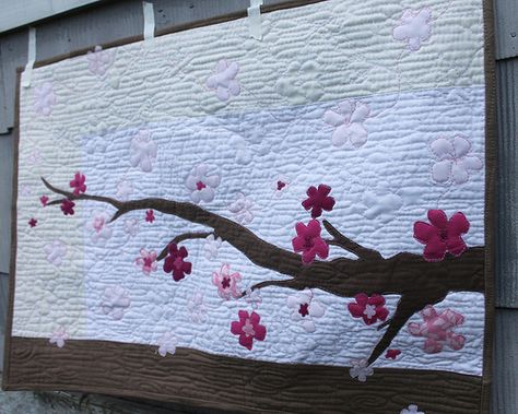 this cherry blossom pattern is closer but still too "wooden".  Like the idea of sakura in the wind. Cherry Blossom Quilt Pattern, Cherry Blossom Quilt, Calendar Quilts, Japanese Quilt Patterns, Japanese Quilts, Sakura Cherry Blossom, Fabric Postcards, Flower Quilts, Applique Pattern