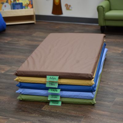 Woodland Rest Mats include plastic name tag holders so kiddos can be assigned their own mat to use each day. Daycare Beds Nap Mats, Rest Time, Quiet Time Activities, Nap Mat, Sleeping Mat, Tag Holder, Sleep Sacks, Learning Spaces, Vinyl Cover