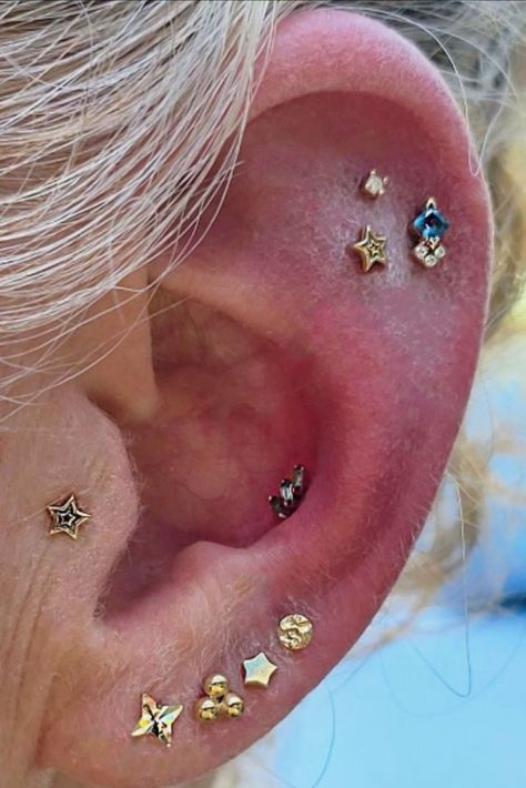 Tragus, conch, lobes, and helix piercings done by ✨Sarah✨ @glitter___goblin using solid 14k yellow gold jewelry. #deeproots #deeprootspiercing #tragus #traguspiercing #conch #conchpiercing #helix #helixpiercing #legitbodypiercing #legitbodyjewelry #piercinggoals #goldjewelry #piercingjewelry 2nd Ear Piercing, Constellation Piercings, Curated Ear, Helix Piercings, Tragus Conch, Buddha Jewelry, Cute Piercings, Deep Roots, Hot Jewelry