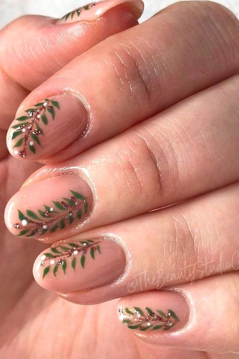 A festive winter nail idea featuring green mistletoe leaves with glitter accents and white berries on a nude base. Nails Mistletoe, Winter Nail Ideas Simple, Nail Ideas Simple, Winter Nail Ideas, Naild It, Nail Idea, Winter Nail Art, Winter Nail, Accent Nails