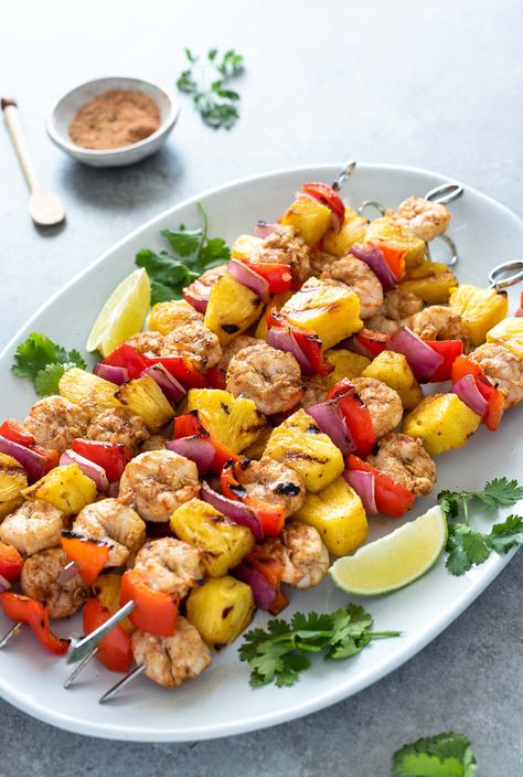 Jerk Pineapple Shrimp Skewers are marinated in a spicy citrus Jamaican jerk marinade and they cook up in 10 minutes!  They're smoky, flavorful and perfect for summer! #shrimprecipes #easydinners #glutenfree Shrimp Kabob Recipes, Grilled Meals, Shrimp Skewer Recipes, Jerk Shrimp, Pineapple Skewer, Pineapple Shrimp, Teriyaki Shrimp, Jerk Marinade, Homemade Guacamole Recipe