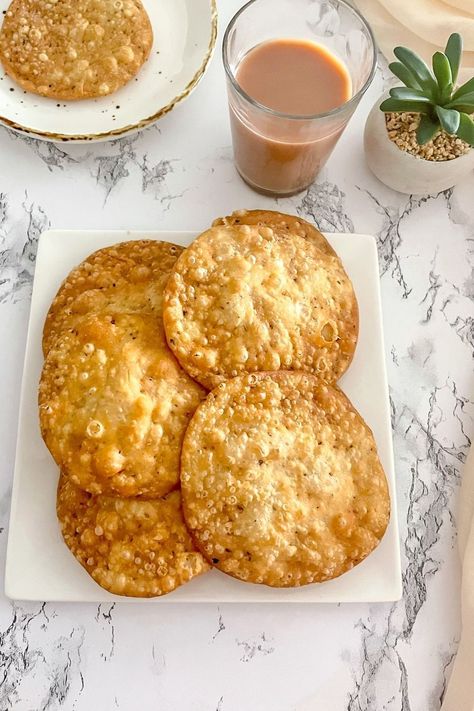 If you’re looking for a crispy snack for your afternoon tea, these crispy puris are perfect! They’re made with only a few ingredients and come together in about 30 minutes. Make a batch of these crispy khasta puri today, and enjoy it for the next few weeks! Pakistani Snacks, Puri Recipe, Chai Coffee, Puri Recipes, Food Flyer, Early Evening, Pakistani Food, Tea Time Snacks, Indian Street Food