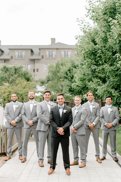 black tux groom grey groomsmen attire Groom In Black Suit Groomsmen In Grey, Black Groom Suit With Grey Groomsmen, Groom Black Tux Groomsmen Grey, Groomsmen Attire Black And Blue, Grooms Man Outfits Groomsmen, Black And Grey Suit Men Wedding, Charcole Suits Wedding, Groom Black Suit Groomsmen Grey, Groomsmen In Grey Suits