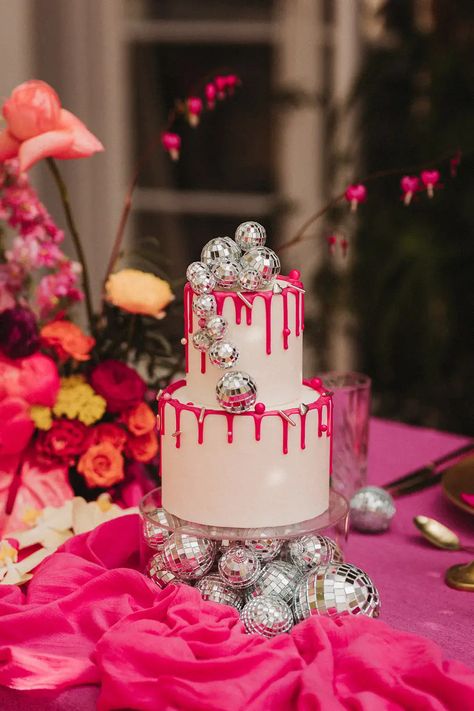 Hot pink theme wedding at Polstrong Manor with fun & vibrant retro decor. The bride wears a short wedding dress and a sparkly reception dress. Disco Cake Table, Pink Disco Table Decor, Birthday Cakes Two Tier, Cake With Disco Ball, Disco Ball Wedding Cake, Ball Cake Design, Pink Disco Cake, Disco Wedding Cake, 2 Tier Cake Designs