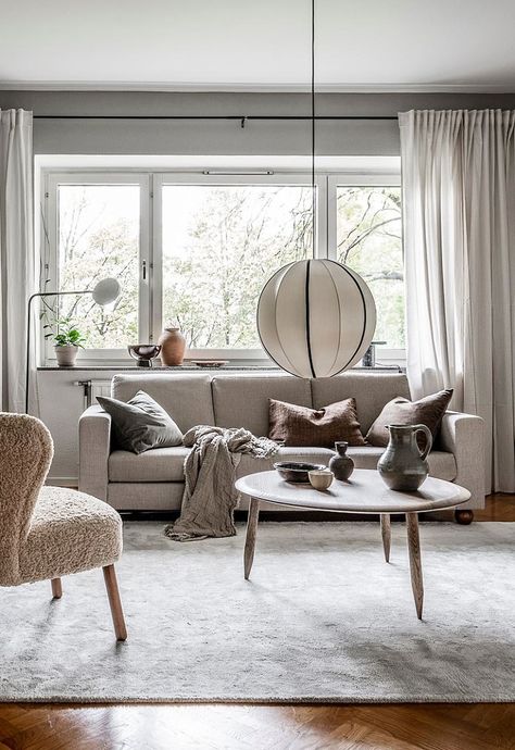 Warm Scandinavian Living Room, Light Oak Hardwood Floors, Scandi Apartment, Warm Grey Walls, Grey Wall Color, Dark Green Walls, Coco Lapine Design, Dark Grey Walls, Beige Curtains