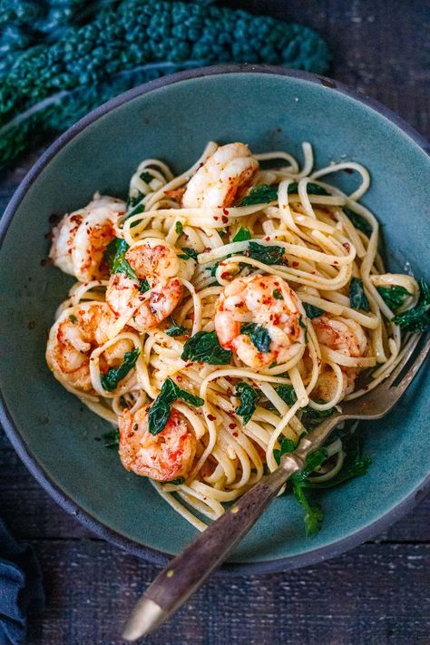 This Shrimp Pasta recipe is fast, easy and full of punchy flavor! Olive oil, lemon zest, fresh garlic, kale and red pepper flakes keep it light and flavorful. A delicious pasta dinner, ready in under 30 minutes. Kale Dinner Recipes, Kale Dinner, Garlic Shrimp Pasta Recipes, Pasta With Kale, Easy Shrimp Pasta, 2024 Photoshoot, Shrimp Pasta Recipe, Lemon Garlic Shrimp Pasta, Garlic Shrimp Pasta