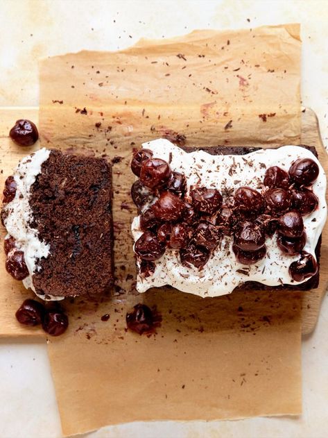 a Black Forest Loaf Cake on parchment paper on top of a wooden cutting board. one slice is cut off and laying on its side. whipped cream and cherries sit on top of the loaf. Hot For Food, Cherry Season, Frozen Cherries, Fresh Cherries, Sweet Breads, Loaf Cake, Cherry Flavor, Vegan Condiments, Whipped Topping