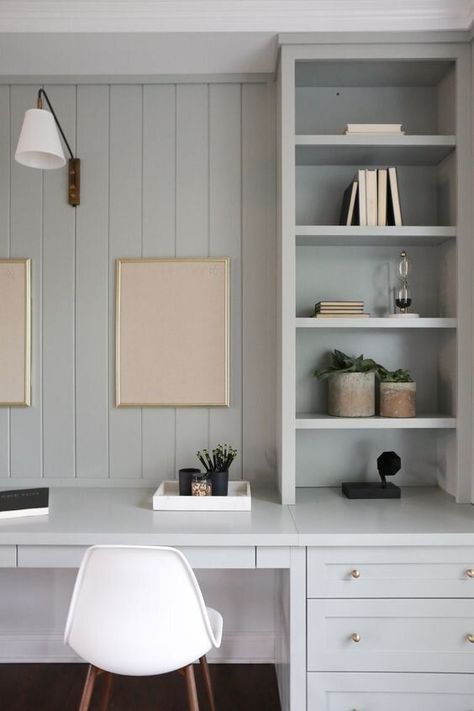 Vertical shiplap and blue-gray cabinets with brass hardware make for a beautiful modern home office. Modern Coastal Office, Coastal Home Office, Office Addition, Addition Project, Blue Home Offices, Coastal Office, Office Built Ins, Modern Coastal Home, Cool Office Space