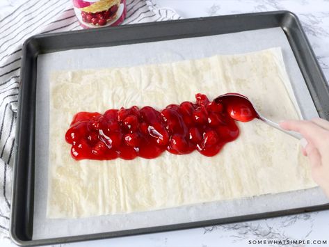 Easy Cherry Strudel Recipe (Flaky & Sweet) Somewhat Simple: This Cherry Strudel is so tasty nobody will believe it is so easy to make! Just a few ingredients stand between you and this flaky, sweet pastry! #baking #fruit Phyllo Strudel Recipes, Fruit Strudel Recipes, Phyllo Dough Recipes Dessert Cherry, Phyllo Dough Recipes Dessert Fruit, Cherry Strudel Recipe Puff Pastries, Cherry Strudel Recipe Phyllo Dough, Cherry Puff Pastry Dessert, Cherry Puff Pastry Recipes, Phyllo Dough Recipes Dessert