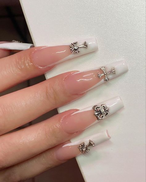 French nails White French Tip Nails With Jewels, French Tip Acrylic Nails Charms, White Chrome Heart Nails, Chrome Hearts Nails White, French Nails With Cross Charm, Nail Inspo With Cross Charm, French Tip With Cross Charm, Nail Designs Cross Charm, Silver Chrome French Tip Nails With Charms