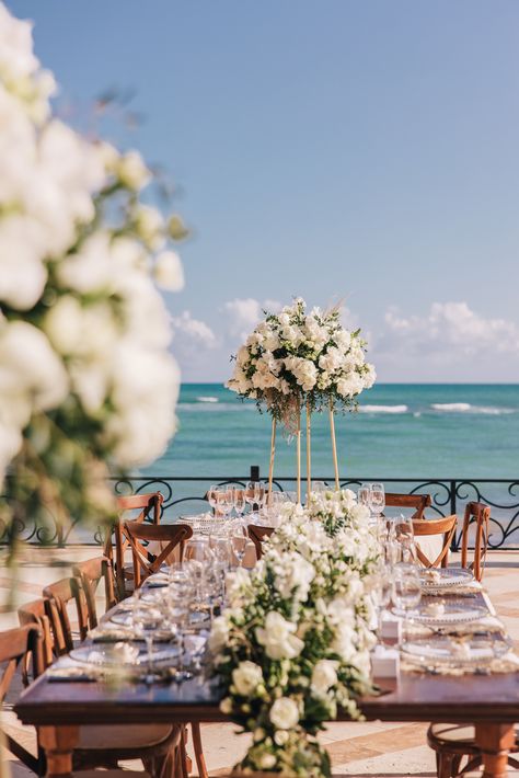 mix and match with rectangular wooden tables and round tables with tablecloth. 
big decoration with white flowers with ocean of backdrop 

riviera maya mexico Table Decor Round Tables, Wedding Table Decor Round Tables, Wedding Table Decor Round, Wedding Reception Centerpiece, White Wedding Centerpieces, Big Decorations, Taylor Wedding, Wedding Reception Centerpieces, Riviera Maya Mexico