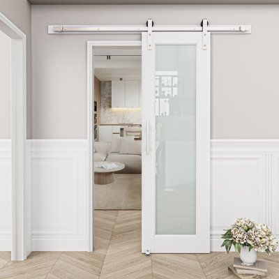 The indoor door is a very important part of family design. Increasing or upgrading doors can increase the value of houses. This door consisting of tempered matte glass and MDF can also protect privacy while light transmittance. 80 '' High door can be used in bedrooms, bathrooms, garage, aisles and cloakrooms. With nickel -plated hardware and track, compared with traditional iron hardware, nickel -plated hardware can resist corrosion, durable, and metallic luster. Home Worthy Size: 24" x 80" | Ba Interior Door With Glass, White Sliding Barn Door, Barn Door Bathroom, Bathroom Barn Door, Modern Sliding Barn Door, Doors Modern, Modern Barn Door, Glass Barn Doors, Door Fittings