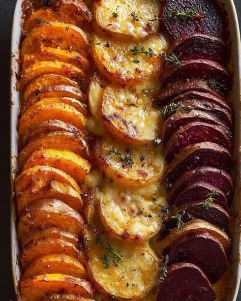 Savor the flavors of a Root Vegetable Gratin made with sweet potatoes, parsnips, and beets. A hearty, colorful dish perfect for cozy dinners. Vegetable Accompaniments, Fall Roasted Vegetables, Mia Recipes, Root Vegetable Recipes, Retreat Recipes, Side Veggies, Lobster Cream Sauce, Root Vegetable Gratin, Vegetable Gratin