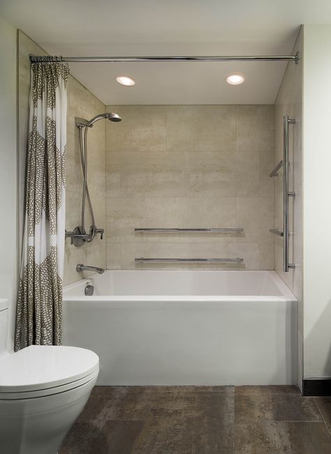 Check out this deep soaking tub! Equipped with a mounted & handheld shower-head and long grab bars for added stability. Sleek & stainless bath fittings are both attractive and practical #mondaymotivation #mondayvibes #washingtondc #luxurylifestyle   Looking for more inspiration from this project? Visit us @ www.CARNEMARK.com  Photography by Anice Hoachlander Soaker Tub With Shower, Soaker Tub Shower Combo, Shower Tile Combinations, Shower Tile Design, Shower Bath Combo, Soaking Tub Shower Combo, Tile Combinations, Big Bathtub, Deep Bathtub