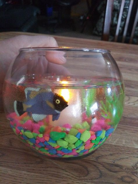 Hand made. Made with resin, toy fish, colored aquarium rocks and plants. Fish Bowl Candle, Candles Holder, Aquarium Rocks, Toy Fish, Bowl Candle, Fish Bowl, Fish Tank, Candle Making, Candle Holder