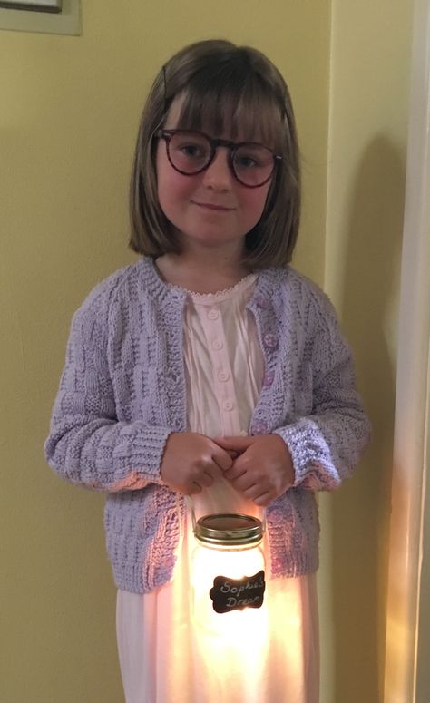 My daughter dressed up as Sophie from Roald Dahl's BFG for her school project. Very simple to create the look for World Book Day - cardigan and nightie purchased at local car boot sale, specs are reading glasses bought for 1.99 with lenses popped out, and 'Sophie's Dream' is a Mason jar lined with tissue paper and battery operated LED fairy lights. Sophie Bfg Costume, Bfg Dream Jars Diy, Roald Dahl Book Day Costumes, Easy Roald Dahl Costumes, Bfg Costume, Roald Dahl Fancy Dress, Costumes With Glasses, Roald Dahl Costumes, Roald Dahl Day