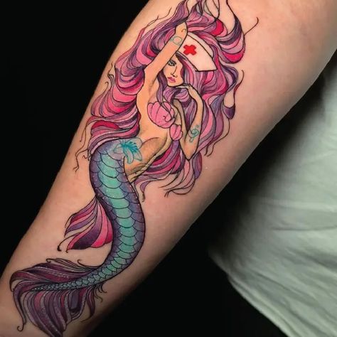 Sexy Mermaid Nurse Neo Traditional Color Tattoo Idea & Design on Forearm Sexy Mermaid Nurse Tattoo Done At Neotraditional Mermaid, Neo Traditional Mermaid Tattoo, Neo Traditional Mermaid, Traditional Color Tattoo, Traditional Mermaid Tattoos, Nurse Tattoo, Mermaid Tattoo, Mermaid Tattoos, Idea Design