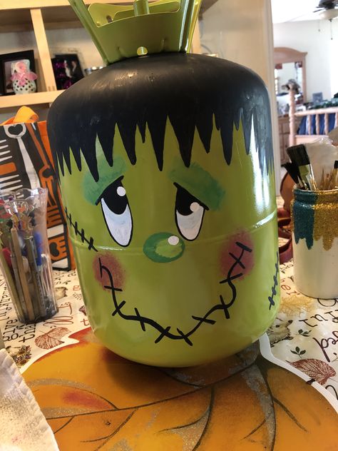 I made this for my grandkids to decorate for Halloween at their house. Made with old/empty Freon tank. Painted by hand. Halloween Propane Tank, Propane Halloween Decorations, Frankenstein Propane Tank, Propane Tank Halloween Decorations, Old Propane Tanks Ideas, Helium Tank Projects, Freon Tank Art, Propane Tank Pumpkins, Halloween Trash Can