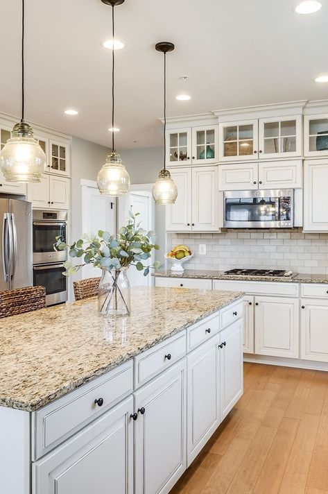 White Cabinet Tan Granite Kitchen, Top White Cabinets Bottom Wood, White Kitchen Cabinets With Earth Tone Granite, Farmhouse Off White Kitchen Cabinets, Kitchen Remodel With Light Wood Floors, Ivory Kitchen Counter Top, Dark Counter Tops With White Cabinets, Cream Colored Kitchen Cabinets With Quartz Countertops, Brown Counter White Cabinets