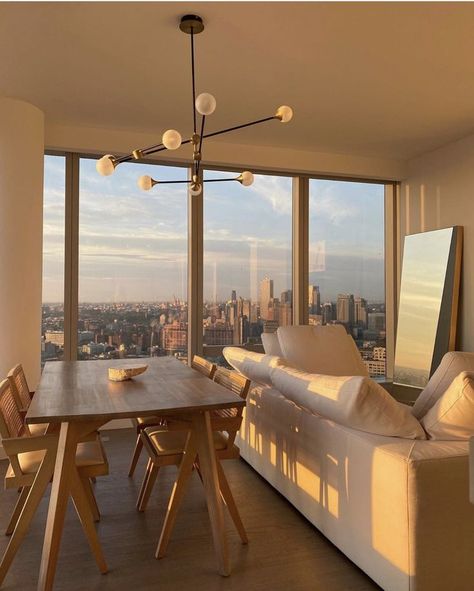 An apartment in New York with the perfect golden hour glow for a dreamy modern space #moderhome #apartment #goldenhour Appartement New York, Sunshine Homes, Aesthetic Apartment, Apartment View, Lots Of Windows, Apartment Aesthetic, New York Apartment, Aesthetic Rooms, Nyc Apartment