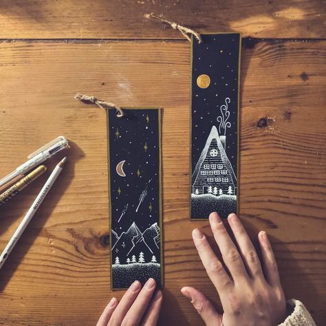 #bookmarks #drawing #blackpaper #golden #whitepen #nightsky #mountains #cottage Bookmark Drawing Ideas, Drawing Ideas Black And White, Drawing Ideas Black, Bookmark Drawing, Bookmarks Quotes, Handmade Bookmarks Diy, Felt Bookmark, Creative Bookmarks, Bookmark Craft